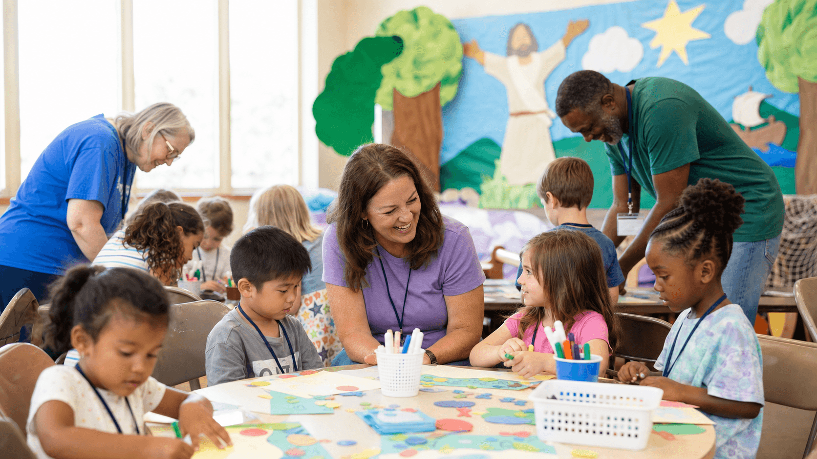 Children and church volunteers participating in Vacation Bible School